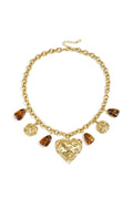 Link chain with dangling beaded coins and statement heart